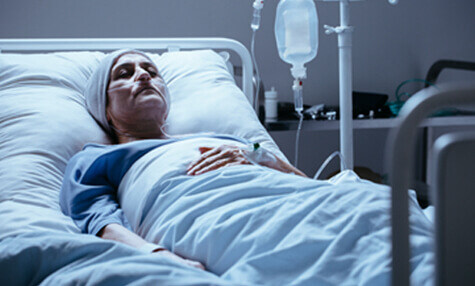 A woman in a hospital bed