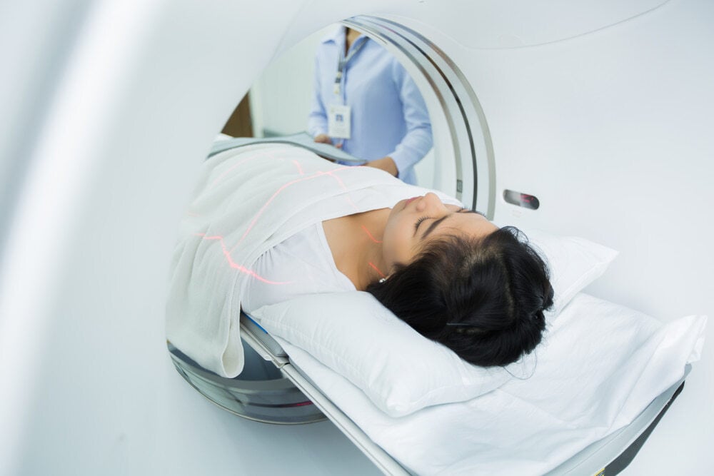 Asian women getting a Ct scan
